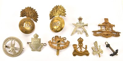 Lot 1185 - A collection of military cap badges including...