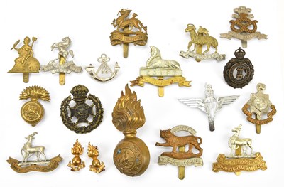 Lot 1172 - A large collection of military cap badges...