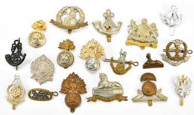 Lot 1177 - A collection of military cap badges including...