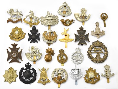 Lot 1178 - A collection of military cap badges including...