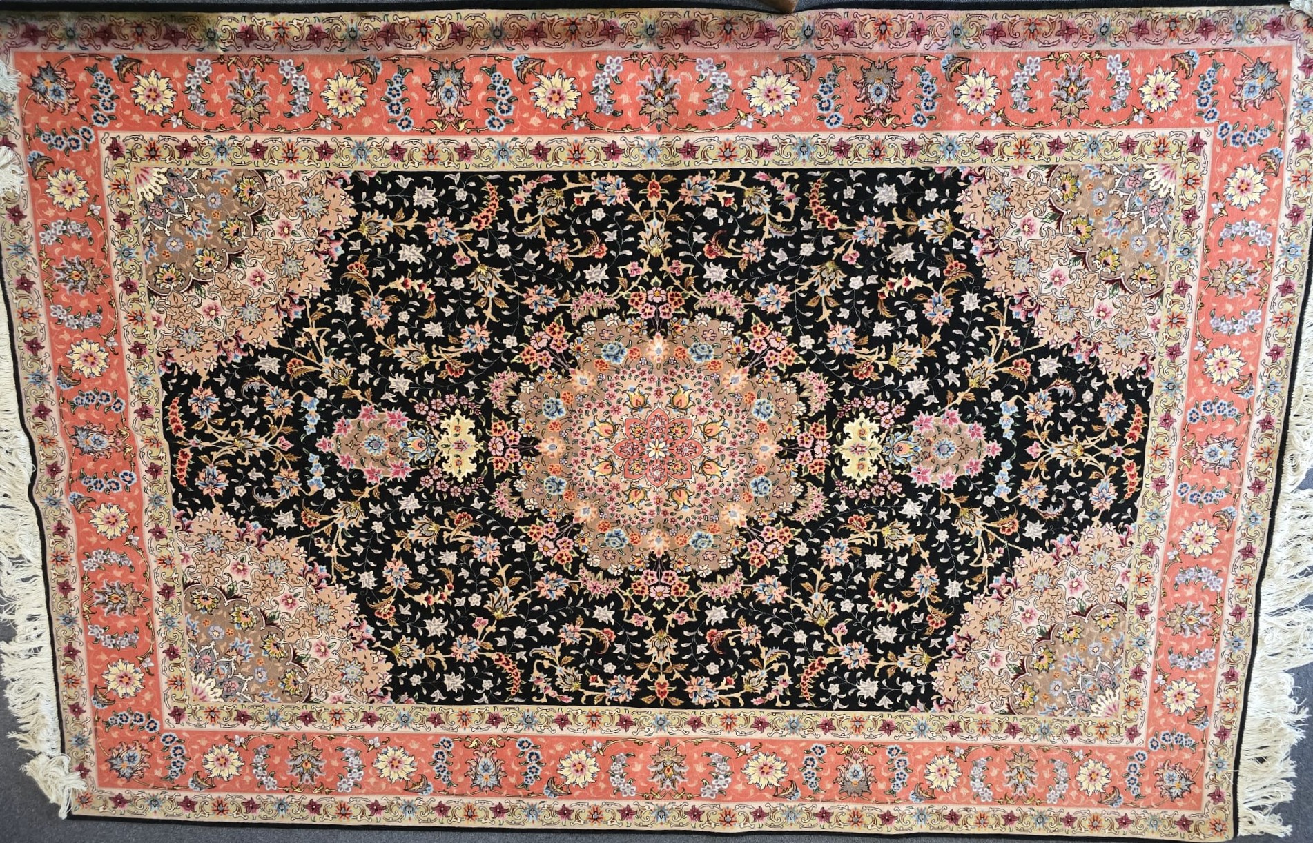 Lot 120 - A large Persian Tabriz carpet, with a
