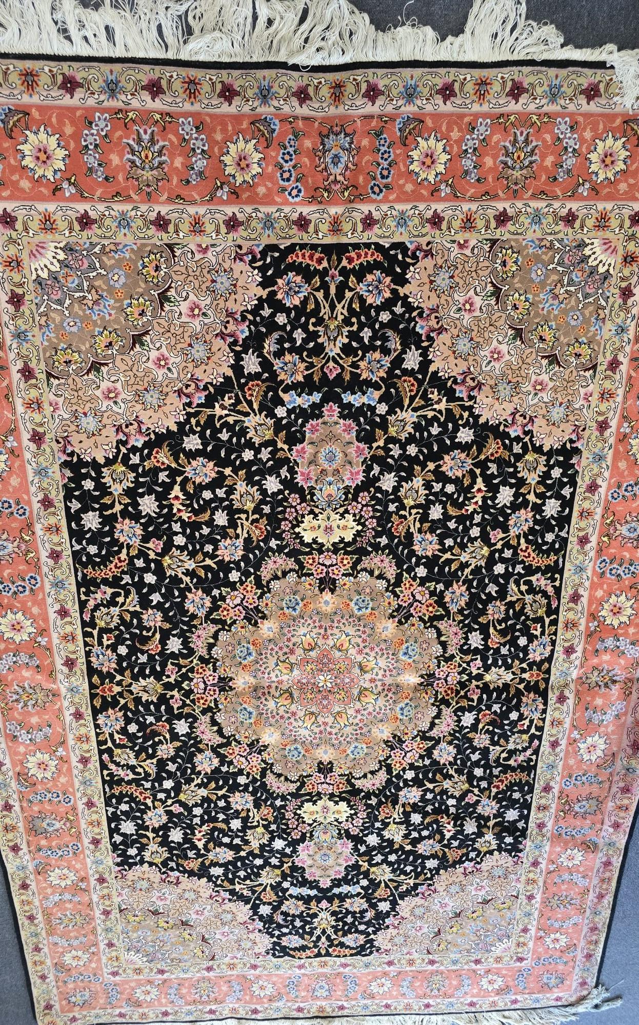 Lot 120 - A large Persian Tabriz carpet, with a