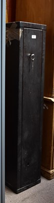 Lot 657 - A black painted steel four-gun cabinet with...