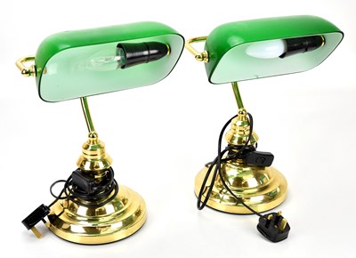 Lot 486 - Two modern desk lamps with green glass shades...
