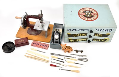 Lot 372 - An advertising Dewhurst Silks three drawer...