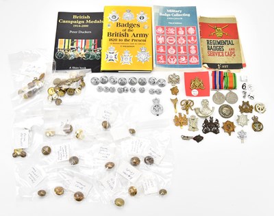 Lot 1159A - A collection of military cap badges and...