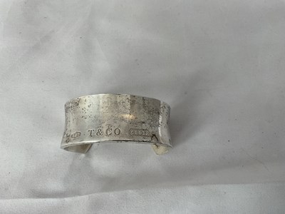 Lot 586 - TIFFANY & CO; a silver cuff bracelet dated...