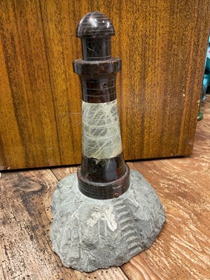 Lot 23 - A Cornish serpentine model of a lighthouse,...