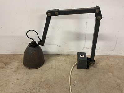 Lot 646 - A vintage industrial articulated bracket lamp