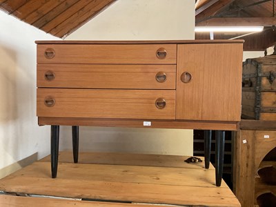 Lot 3 - A mid century teak veneered sideboard with...