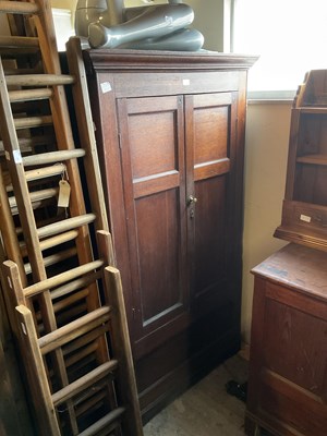 Lot 15 - An 18th century oak tack cupboard with moulded...