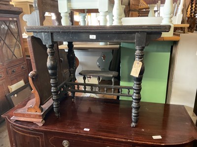 Lot 22 - A Victorian ebonised fold over games table...