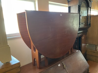 Lot 32 - A teak drop-leaf dining table, width 107cm,...