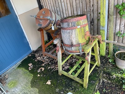 Lot 104 - WAIDE & SONS; two metal bound milk churns on...