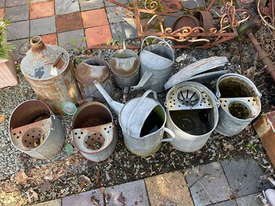 Lot 106 - Four galvanised watering cans, with four...