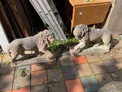 Lot 109 - A pair of reconstituted stone lions on...