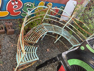 Lot 112 - A decorative painted arch shaped garden bench.