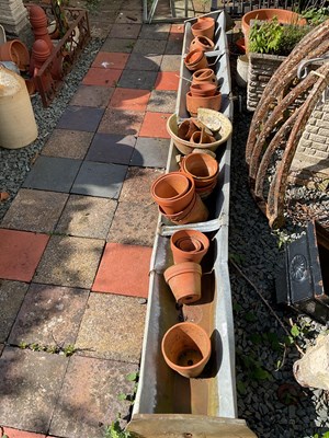 Lot 133 - A large galvanised animal feeder, with a...