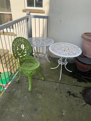 Lot 134 - A green painted cast iron fern leaf chair in...