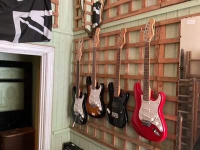 Lot 144 - Four modern electric guitars, including Encore...
