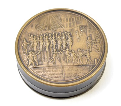 Lot 2 - A 19th century French metal and lacquered snuff box of circular form