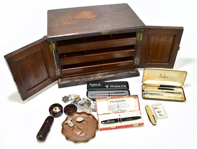 Lot 1081 - A two door collectors' cabinet, with sundries...