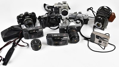 Lot 1397 - A collection of film cameras, digital cameras,...