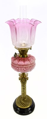 Lot 1492 - A Victorian oil lamp, cranberry and frosted...