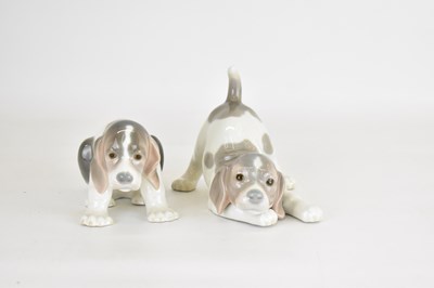 Lot 539 - LLADRÓ; two porcelain figures of puppies, one...