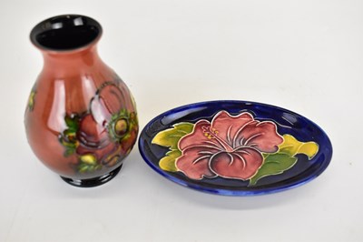Lot 496 - MOORCROFT; a small vase of baluster shape,...