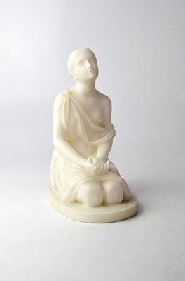 Lot 585 - A marble statue of a young kneeling woman in...