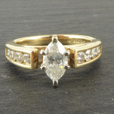 Lot 997 - A 14ct gold diamond ring, the central marquise...