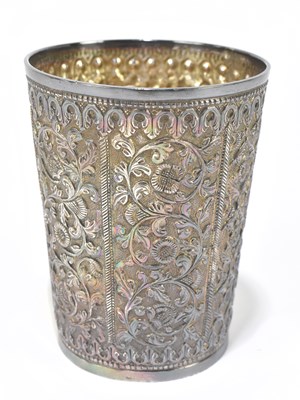 Lot 1118 - An Indian white metal beaker of tapering cylindrical form
