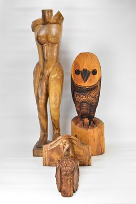 Lot 579 - A carved wooden sculpture of a naked female...