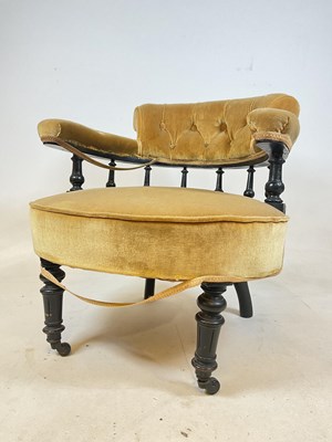 Lot 543 - An ebonised nursing chair with Dralon type...