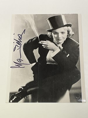 Lot 2156 - MARLENE DIETRICH; a black and white photograph...
