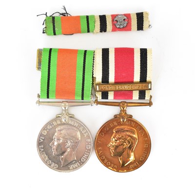 Lot 603 - A WWII defence medal and a Faithful Service...