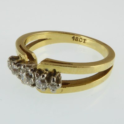 Lot 1001 - A contemporary 18ct gold diamond ring set with...