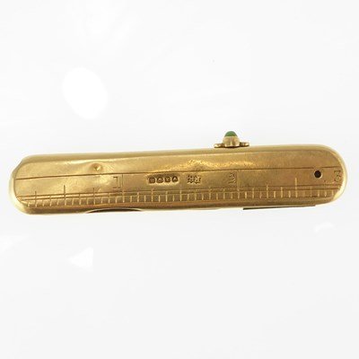Lot 1285 - An 18ct gold propelling pencil/penknife, the...