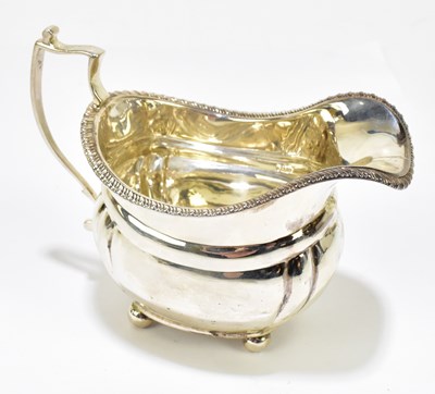 Lot 1139 - HARRODS LTD; a George V hallmarked silver cream jug