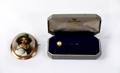 Lot 1288 - A yellow metal stick pin floral set with...