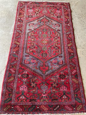 Lot 439 - A Khamseh red ground rug, 205 cm x 105cm.