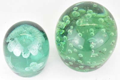 Lot 568 - Two Victorian green glass dump paperweights,...