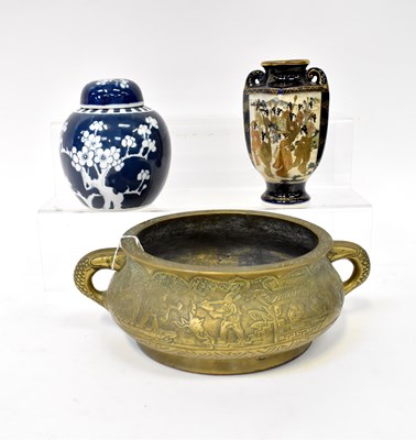 Lot 329 - An Eastern brass twin-handled bowl with...