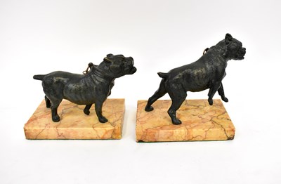 Lot 588 - A pair of bronzed cold painted dogs on marble...