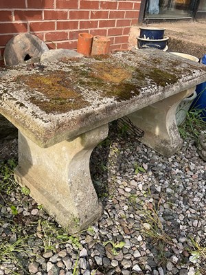 Lot 574 - A reconstituted stone three piece garden bench,...