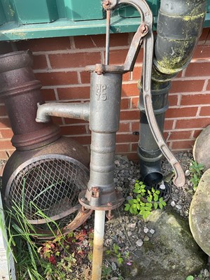 Lot 578 - A waterpump, a chimney and a fireplace.