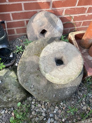 Lot 580 - Four reconstituted stone millstone wheels,...
