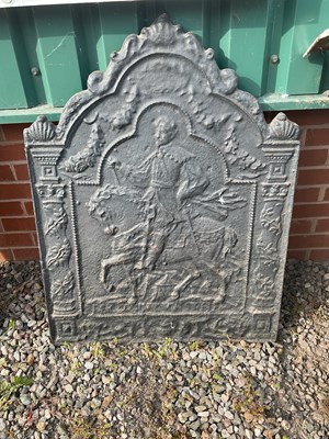 Lot 571 - A large heavy cast iron fireback, 77 x 100cm.