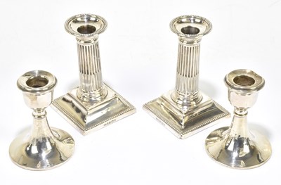 Lot 1110 - HARRISON BROS & HOWSON; a pair of Victorian hallmarked silver squat Corinthian column candlestick